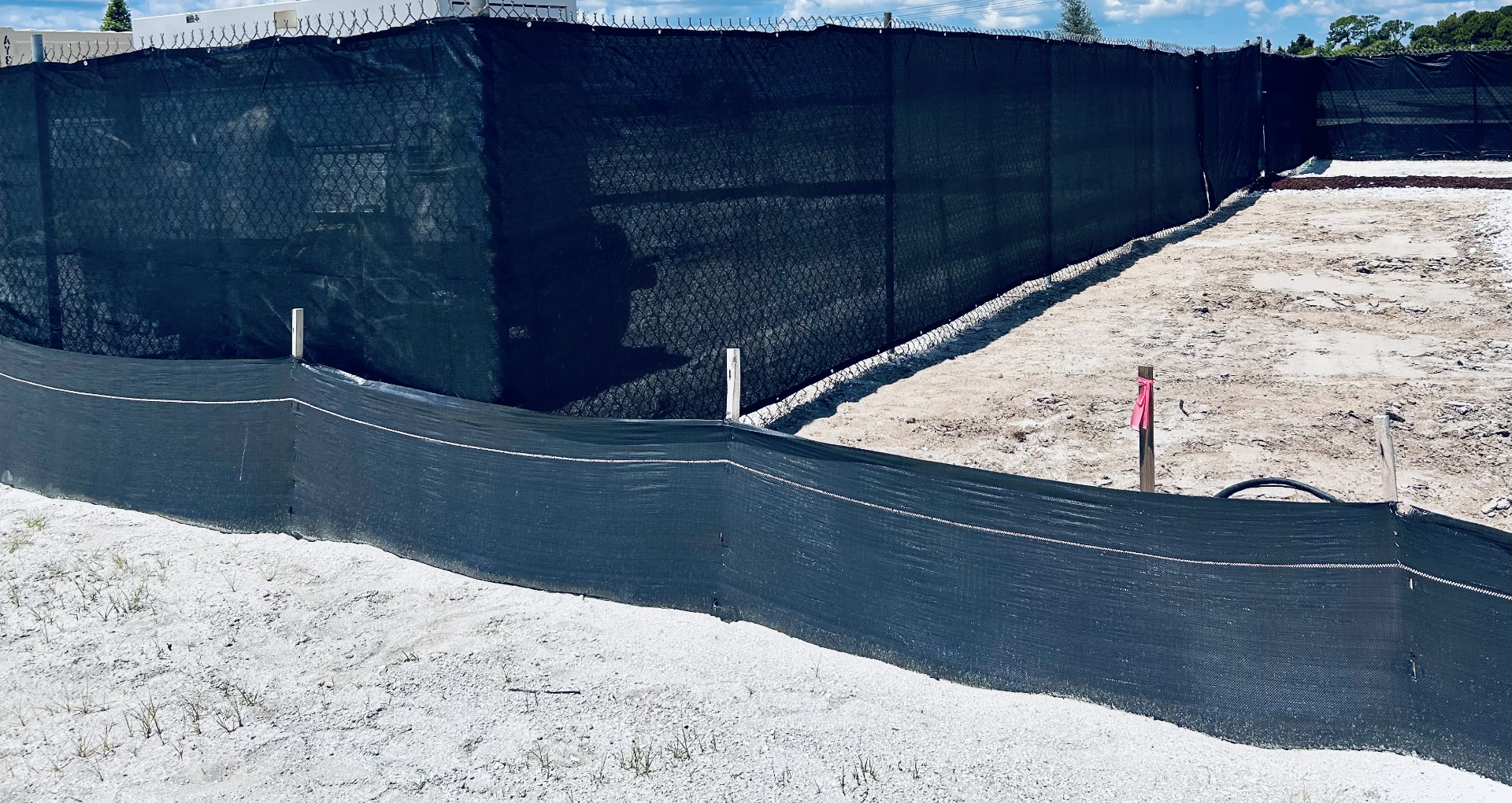 Silt fence installed along the property perimeter for stormwater compliance